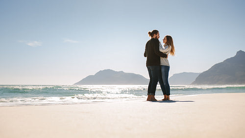 Romantic couple on the sea shore