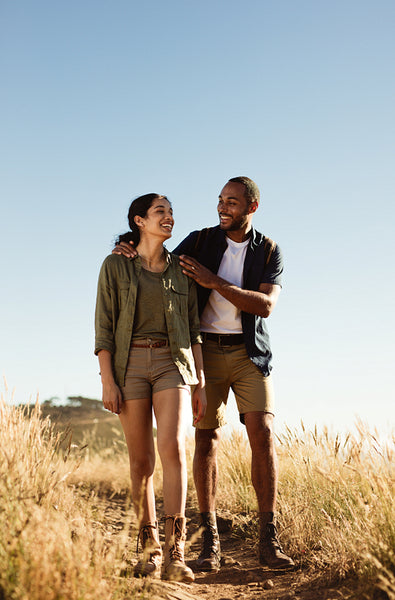 Couple hiking on rough terrain
