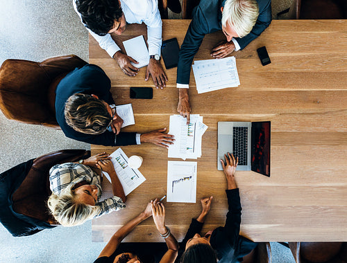 Team of business people sitting together in discussion