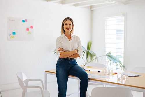 Business manager smiling happily in a creative office