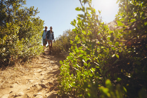 Young couple hiking on a summer day
