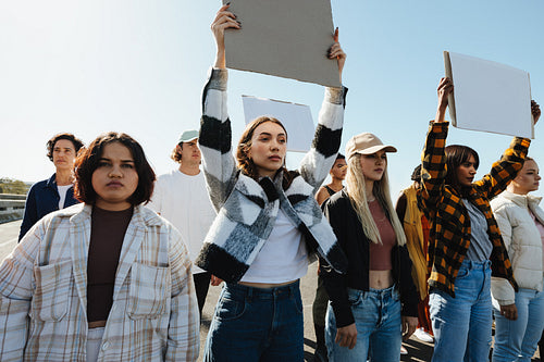 Group of activists holding signs and advocating for social and environmental changes