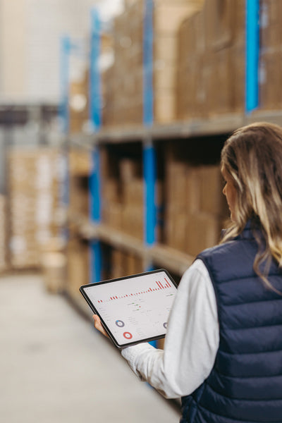 Warehouse manager using a warehouse management system on a digital tablet