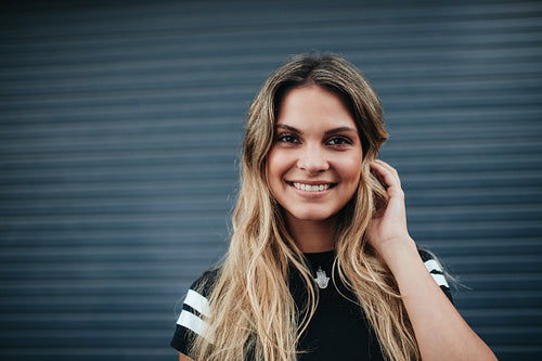 Young woman posing against gray background