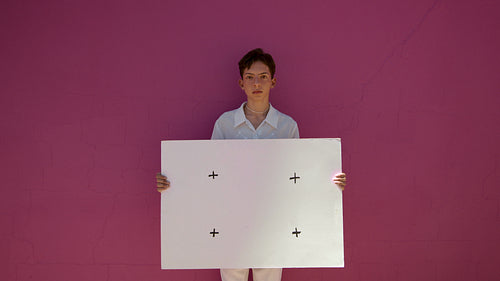 Gender fluid person with blank billboard