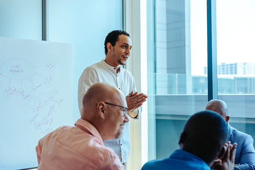CEO leading a strategic discussion in a modern meeting room