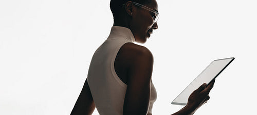 Businesswoman holding digital tablet with blank screen for technology mockups