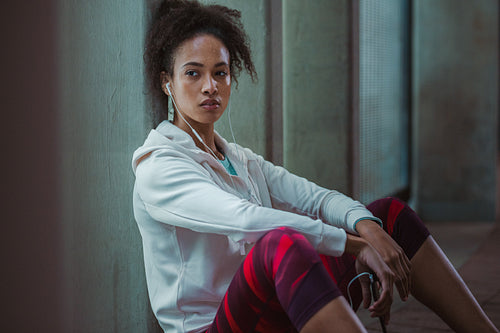 Urban runner resting after training