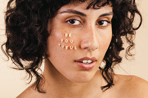 Beautiful young woman looking at the camera