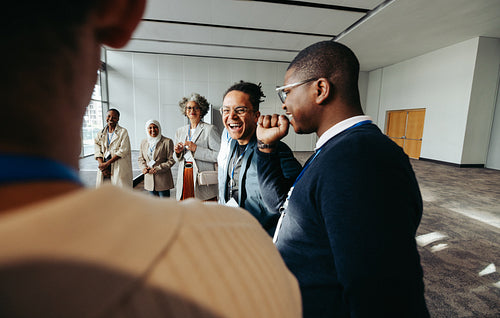 Joyful businesspeople engaging in a lively meeting session