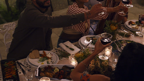 Friends raising a toast at party