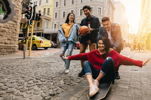 Happy asian friends enjoying in the city