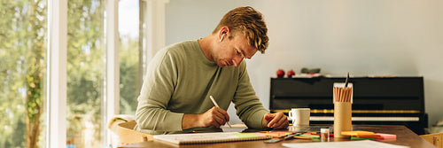 Man working on his designs at home