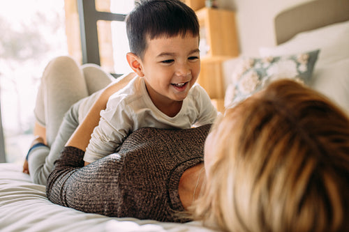 Mother and son having a fun time at home