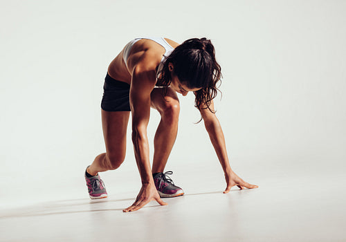 Fit female athlete ready to run