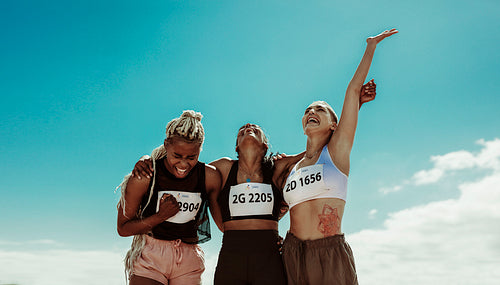 Team of runners rejoicing success