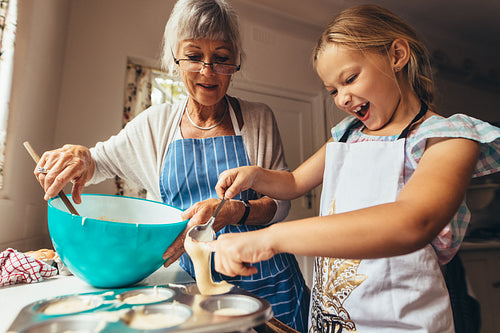 Girl making cup cakes