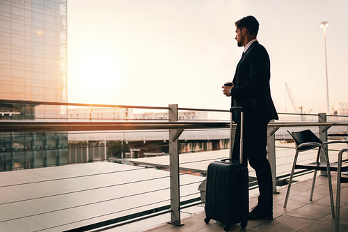 Businessman waiting for his flight in airport lounge