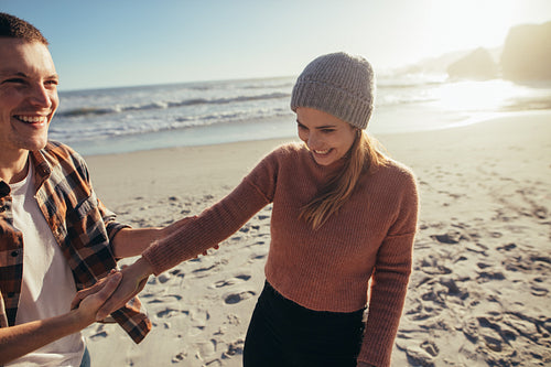 Happy young couple on the beach