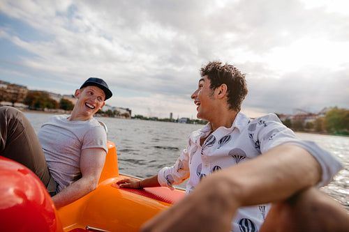 Teenage boys enjoying boating in the lake