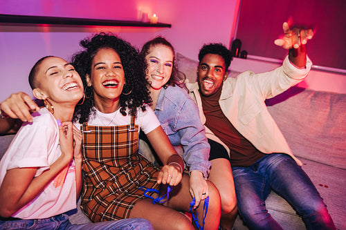 Group of friends having fun at a house party