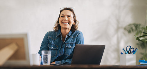 Successful businesswoman embracing her achievements