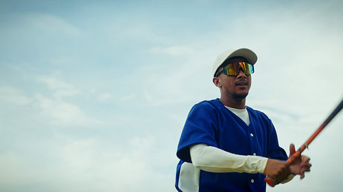 Baseball player practices his swing