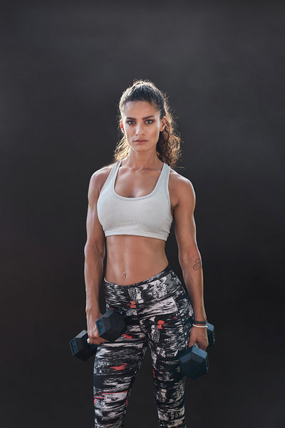 Fitness woman exercising with heavy weights