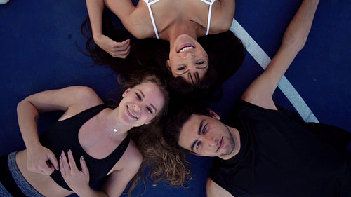 High angle view of happy friends taking a selfie in a basketball court