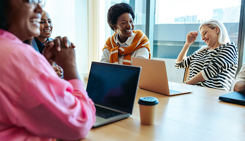 Female team engaging in a productive marketing meeting with colleagues
