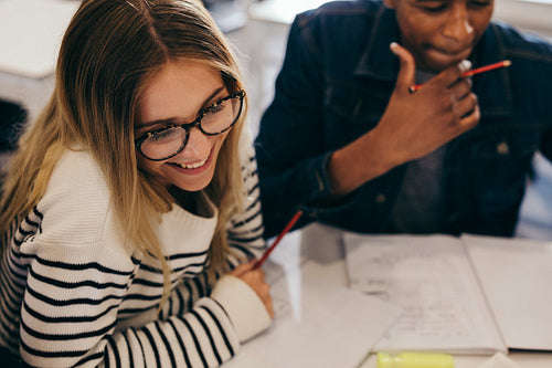 Girl studying with classmates