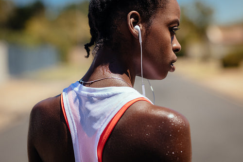 Woman taking a break after a run outdoors