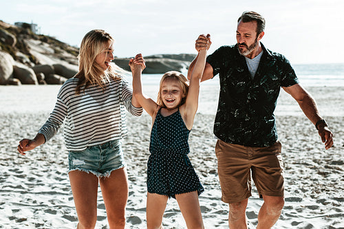 Family playing at the beach