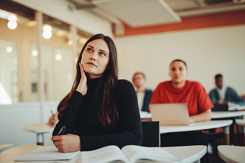 Thoughtful student in college classroom