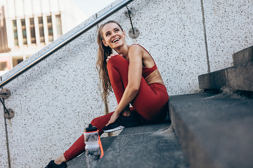 Fitness woman taking break after a run