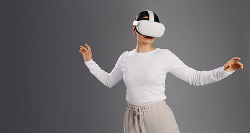 Woman interacting with cyberspace using a vr headset