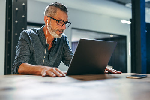 Businessman attending a virtual meeting in a modern office