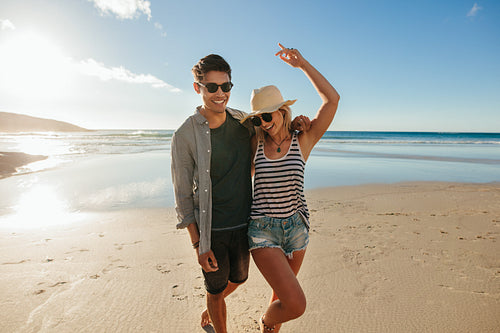 Young couple in love enjoying on the beach