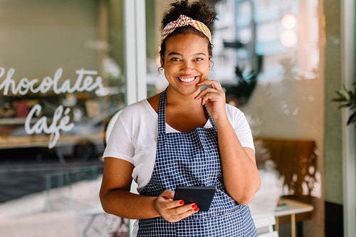 Young businesswoman smiling and using her tablet pc