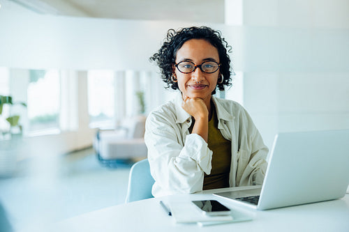 Woman at laptop in tech office