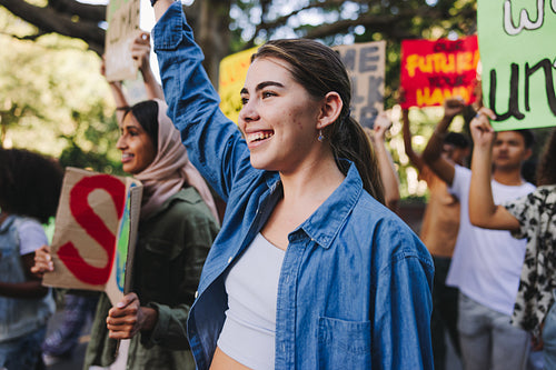 Happy young people standing up against climate change