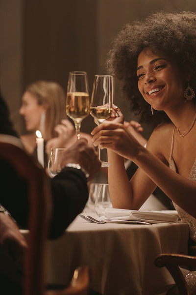 Couple at party enjoying drinks