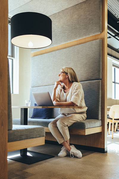Thoughtful businesswoman working in a modern workspace