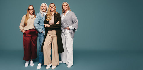 Strong independent women smiling cheerfully in a studio