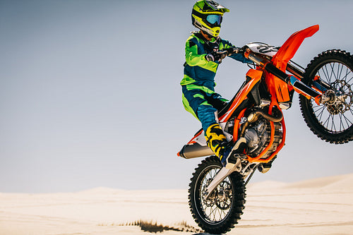 Biker performing dangerous stunts