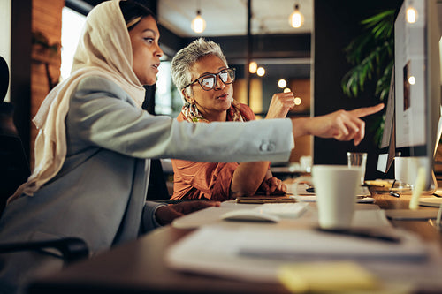 Two businesswomen having a discussion in a modern office