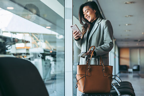 Businesswoman waiting for the flight at airport