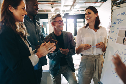 Business team applauding a successful presentation