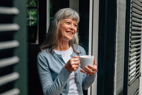 Portrait of a senior woman holding a coffee cup