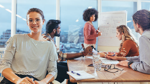 Business colleagues in a meeting sitting in board room